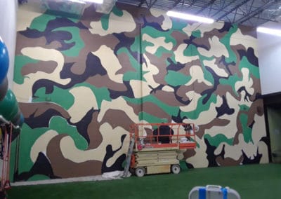 camouflage mural on cinder block wall in Gainesville, VA