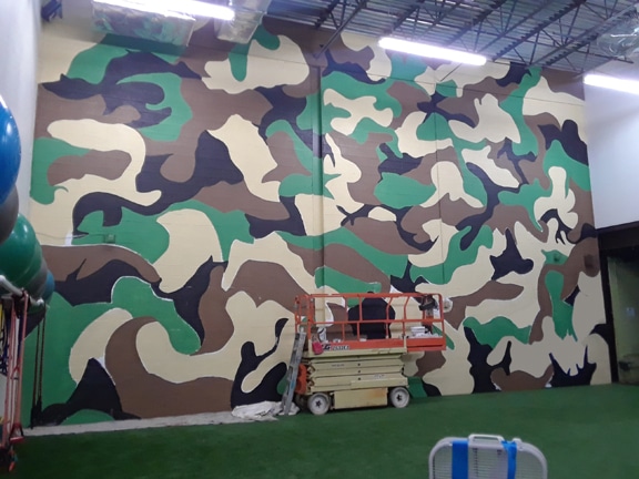 Camouflage Mural adds Grit to Company Gym