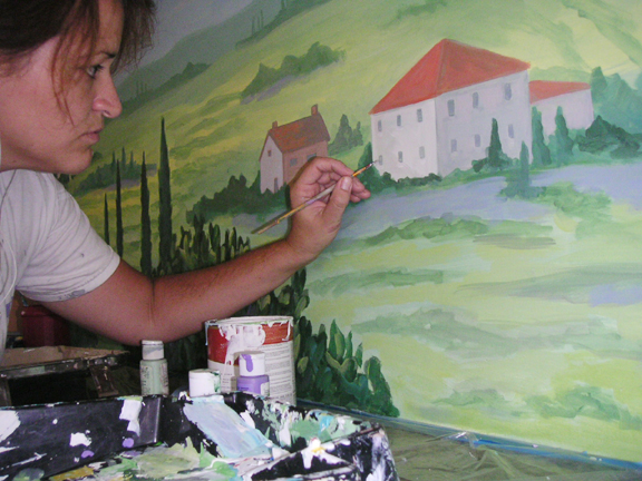 Amy Tubbs painting mural of rural house in the country